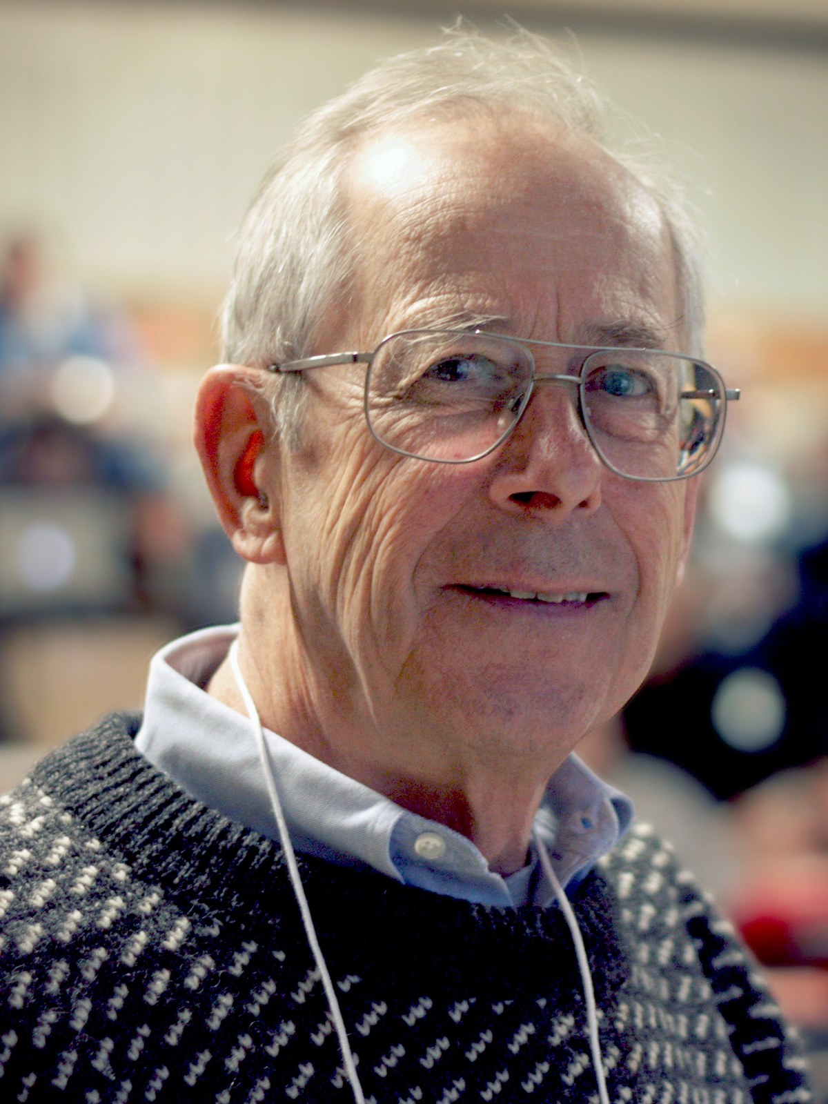James Peebles in May 2010, head and shoulders, wearing a conference lanyard