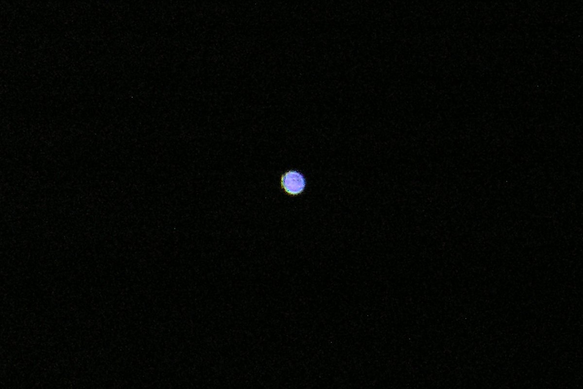 A single blue-white point of light on a black field, the only thing visible in a ten-second exposure