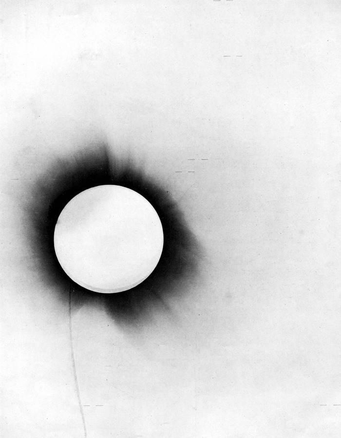 Negative of the 29 May 1919 total solar eclipse, the Sun’s corona as a dark disc and the measured stars marked with short lines