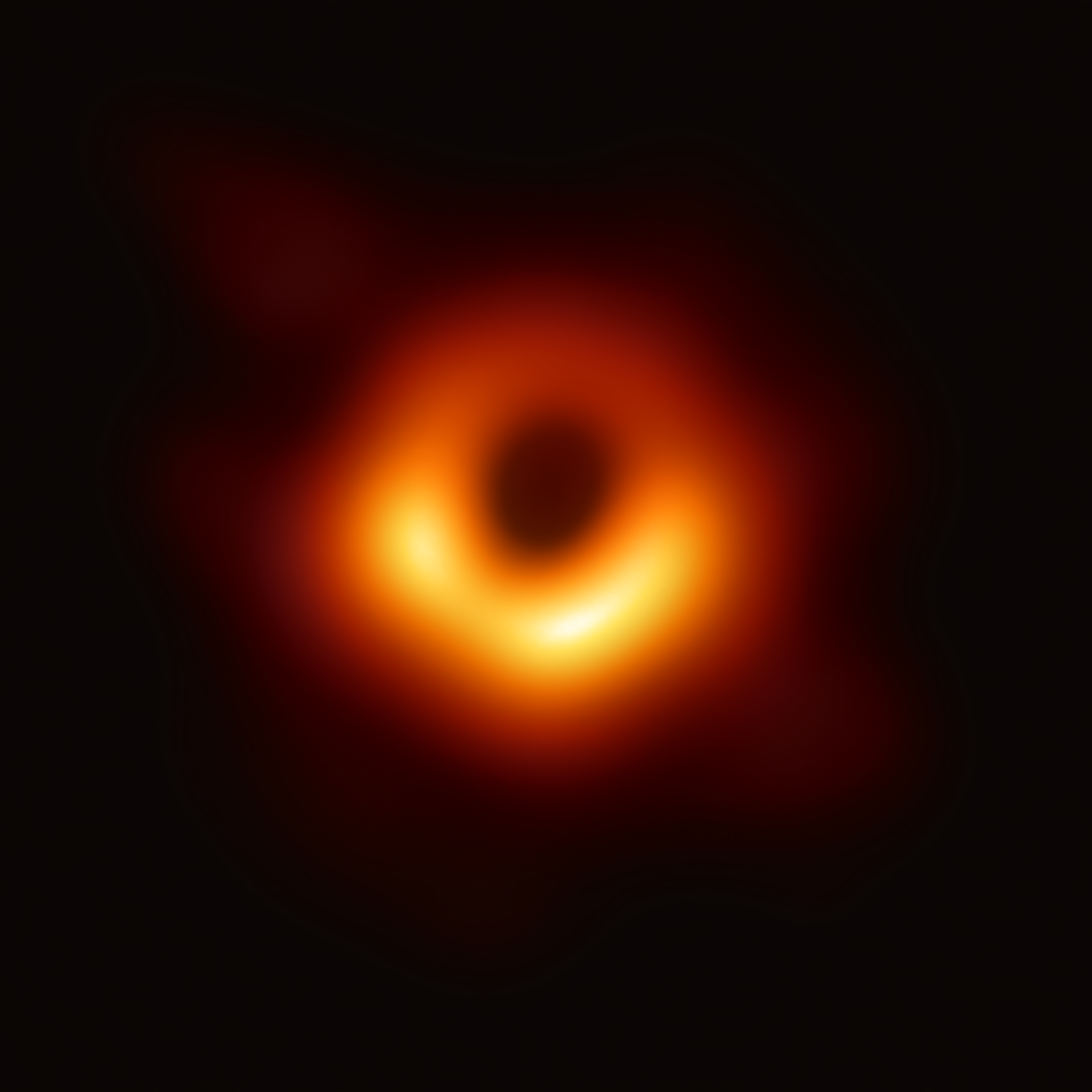 The Event Horizon Telescope’s image of the supermassive black hole at the center of galaxy M87, showing a bright ring of superheated gas around a dark central shadow